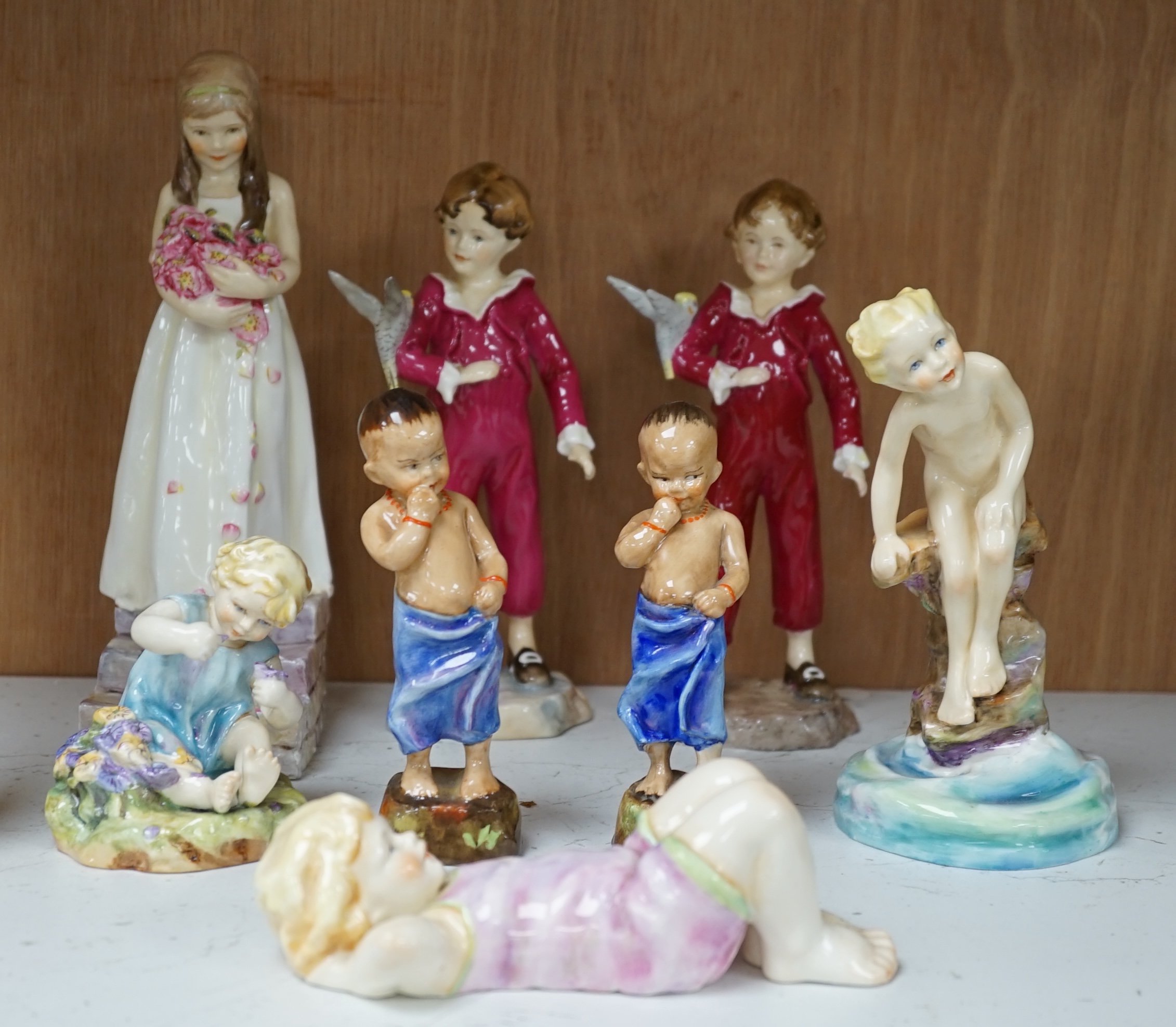 Eight various Royal Worcester F.G. Doughty figures including Happy Boy, Water Baby, Mischief, Parakeet, etc. Condition - good